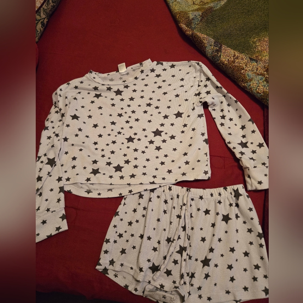 Cute white and black shorts and crop top pj set. Size medium but fit like small.